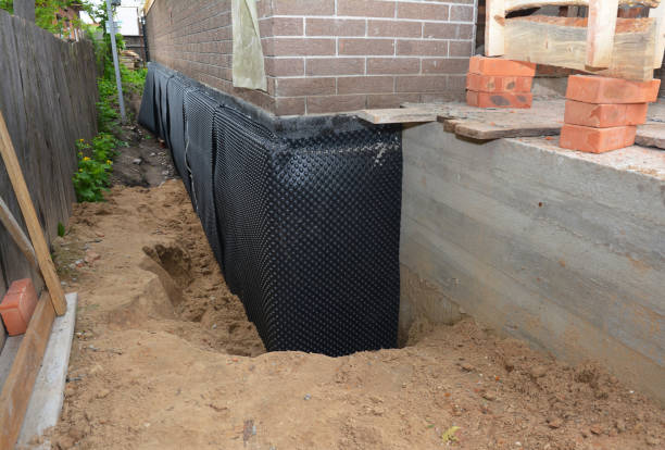 Happy homeowners after waterproofing job in Garfield